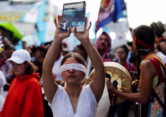 Demonstrators take part in a march to protest against the decision of Guatemala President Jimmy Morales to end the mandate of the U.N.-backed anti-graft commission (CICIG), in Guatemala City