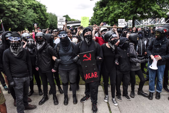 Image: Members of Antifa line up during an alt-right rally in Portland, Oregon