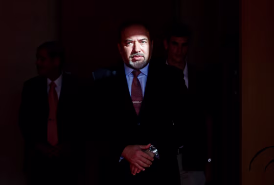 Israel's former Foreign Minister Lieberman waits for the arrival of EU's Foreign Policy Chief Ashton in Jerusalem