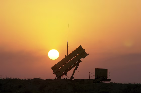 Patriot anti-missile missiles are aimed skyward at a base ne