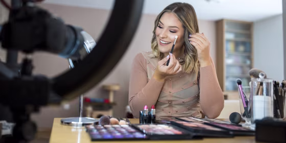 Vlogger reviewing make up products
