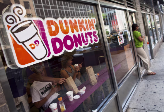 A customer exits a Dunkin' Donuts store in Manhattan in 2011.