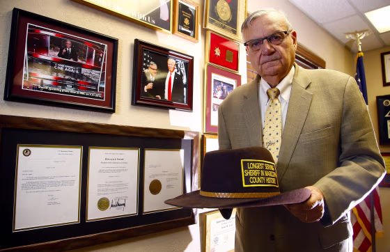 Image: Former Maricopa County Sheriff Joe Arpaio in Fountain Hills, Ariz., on Aug. 26, 2019. Arpaio stands next to his presidential pardon from President Donald Trump.