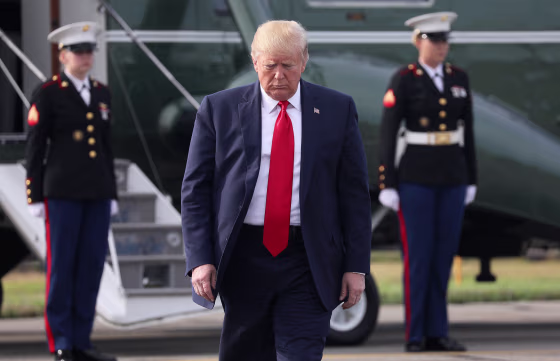 Image: President Donald Trump prepares to speak to reporters before boarding Air Force One at Morristown Municipal Airport in Morristown