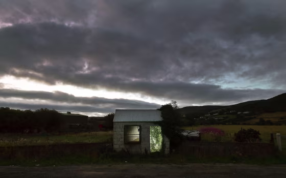 Image: A former customs guard hut is illuminated on the Irish border on Aug. 23, 2018 in Ravensdale, Ireland.