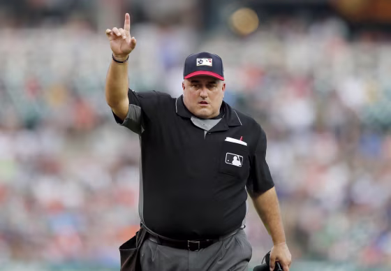 Image: Umpire Eric Cooper signals during a baseball game between the Detroit Tigers and Boston Red Sox in 2019.
