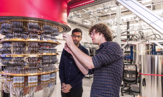 Image: A handout picture shows Pichai and Sank with one of Google's Quantum Computers in the Santa Barbara lab