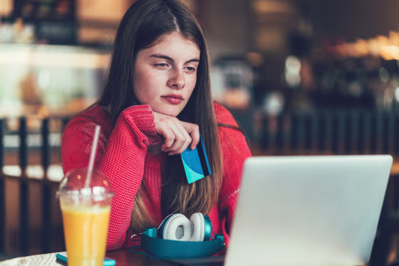 Girl shopping online with credit card