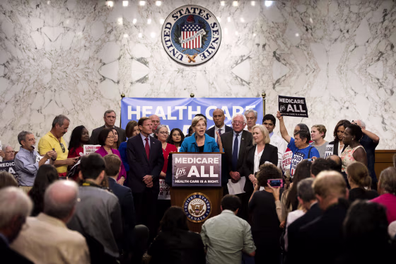 Image: Sen. Elizabeth Warren speaks alongside Sen. Bernie Sanders about Medicare for All legislation on Capitol Hill in 2017.