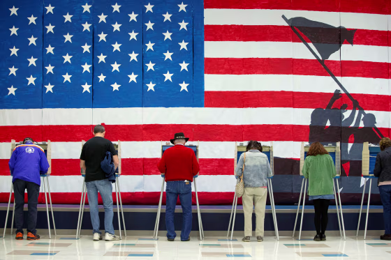Image: Voters cast their ballots to vote in state and local elections at Robious Elementary School in Midlothian, a suburb of Richmond