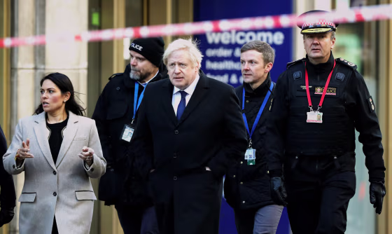 Image: British Prime Minister Boris Johnson arrives to the scene of a stabbing that left two people dead in London on Nov. 30, 2019.
