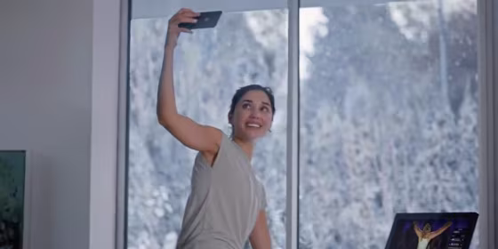 Caption: Monica Ruiz in the Peloton ad called \"The Gift That Gives Back.\"