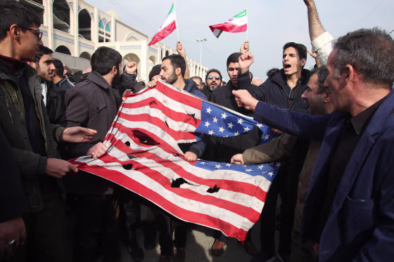 Image: Iranians tear up a U.S. flag during a demonstration in Tehran on Jan. 3, 2020 following the killing of Iranian Revolutionary Guards Major General Qassem Soleimani in a U.S. strike on his convoy at Baghdad international airport.
