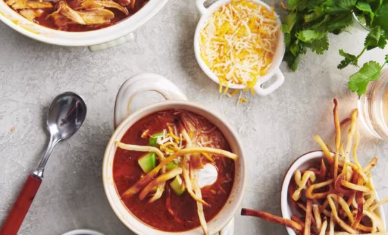 This soup is scented with chili, cumin and coriander, and topped with all kinds of deliciousness, like avocado and tortilla crisps.