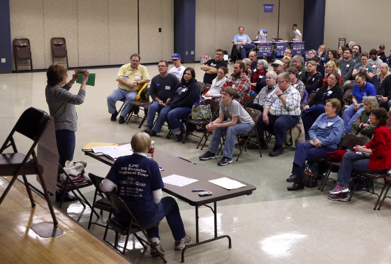 Voters listen to instructions during a Democratic Party caucus in Nevada, Iowa, on Feb. 1, 2016.