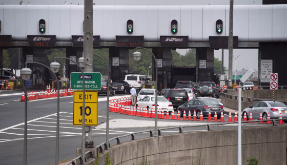Image: A man gets out of his vehicle to see what the backup is at the toll on the George Washington Bridge from Bruce Reynolds approach