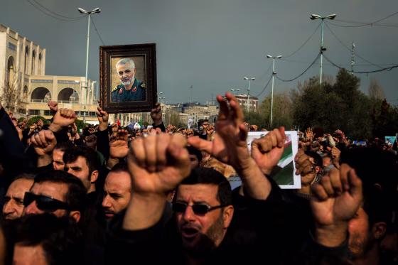 Image: Protesters hold a photo of Iranian General Qassem Soleimani during a demonstration in Tehran on Jan. 3, 2020.