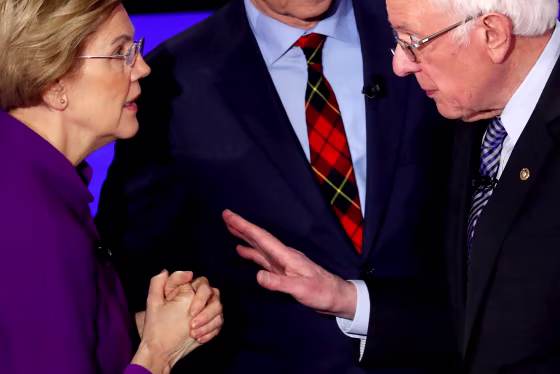 Image: Sen. Elizabeth Warren and Sen. Bernie Sanders speak after a Democratic presidential debate at Drake University in Des Moines, Iowa, on Jan. 14, 2019.