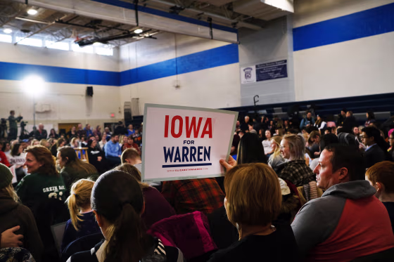 Image: Supporters listen as Democratic presidential candidate Sen. Elizabeth Warren (D-MA) speaks during a town hall event at a school on Jan. 19, 2020 in Des Moines, Iowa.