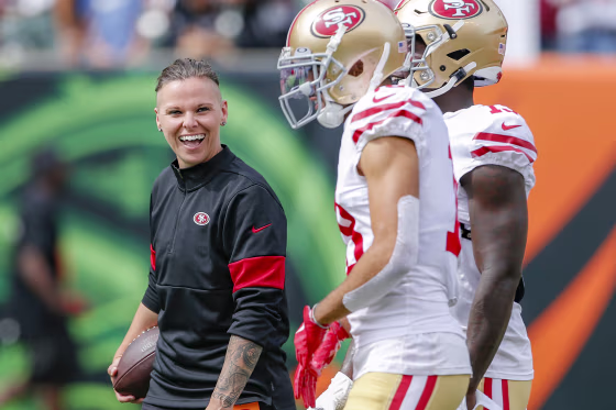 San Francisco 49ers offensive assistant coach Katie Sowers stands on the field before an NFL football game against the Cincinnati Bengals in Cincinnati on Sept. 15, 2019.