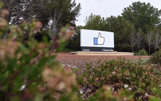 Image: A sign is seen at the entrance to Facebook's corporate headquarters