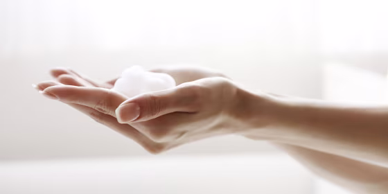 Face-wash foam on hands