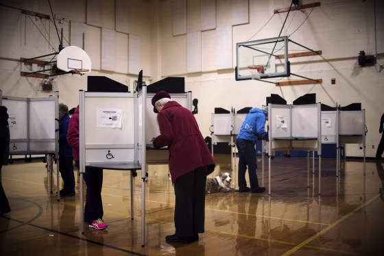 Image: Voters cast ballots on \"Super Tuesday\" at a polling station in Williston, Vt., on March 1, 2016.