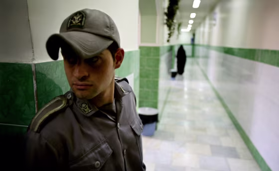 Image: Prison guard stands along corridor in Tehran's Evin prison