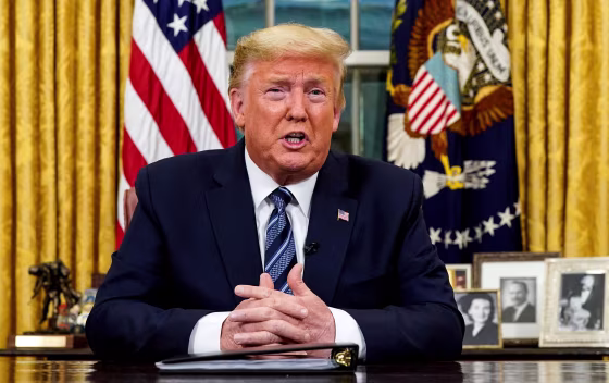 Image: President Trump speaks about the U.S response to the COVID-19 coronavirus pandemic during an address to the nation from the Oval Office of the White House
