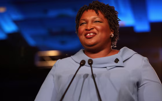 Image: Stacey Abrams speaks to the crowd of supporters announcing they will wait till the morning for results of the mid-terms election at the Hyatt Regency in Atlanta