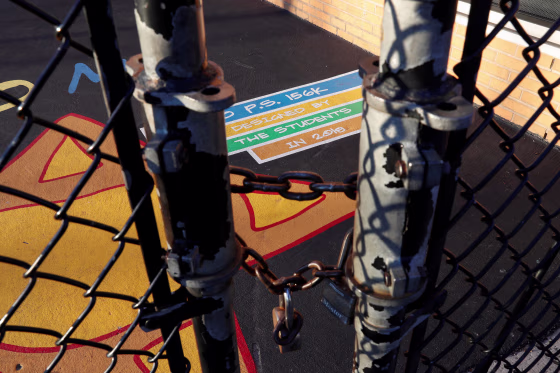 Image: A fence is locked outside the playground at P.S. 156 and L.S. 392,  as the New York City school system canceled classes after further cases of coronavirus were confirmed in New York, in the Brownsville section of the Brooklyn borough of New York
