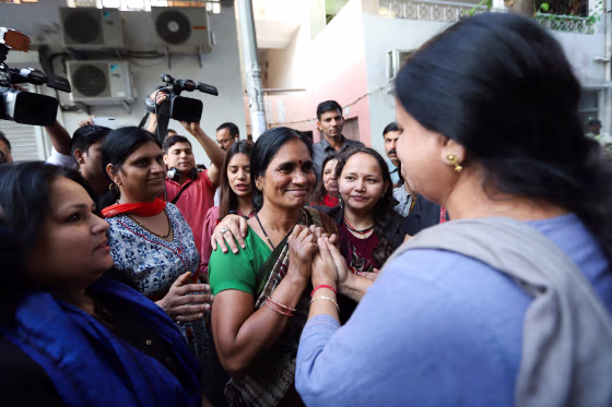 Image: Asha Devi (C), the mother of a gang-rape victim, reacts after the convicts of her daughter's case were hanged in New Delhi
