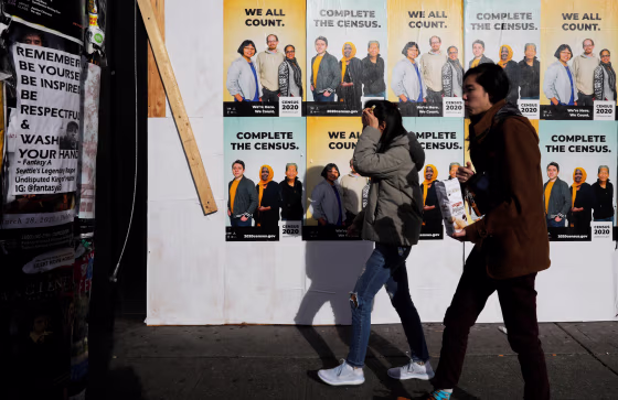 Image: Signs for the 2020 U.S. Census on boarded up businesses in Seattle on March 23, 2020.