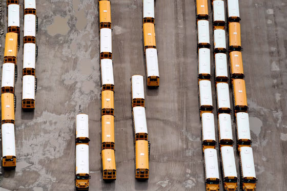 Image: School buses wait to be shipped at the IC of Oklahoma Tulsa Bus Plant in Tulsa