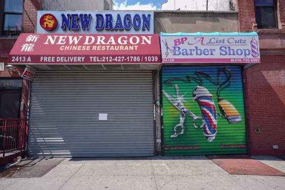 Image: A Chinese restaurant and barber shop in Harlem are closed,
