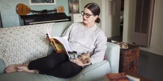 Woman on couch reading