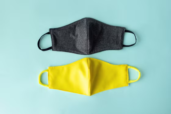 Image: Reusable medical mask. Zero waste. Coronavirus epidemic. Protection against a virus. White background. Material for creativity fabric