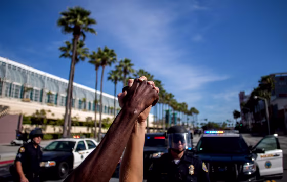 Image: People hold hands in solidarity during a protest demanding justice in the death of George Floyd in Long Beach, Calif., on May 31, 2020.