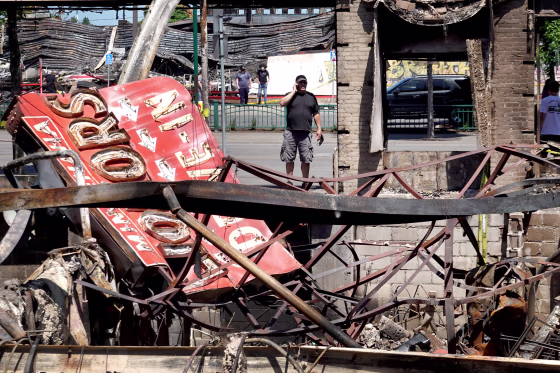 Image: The charred remains of a liquor store in Minneapolis