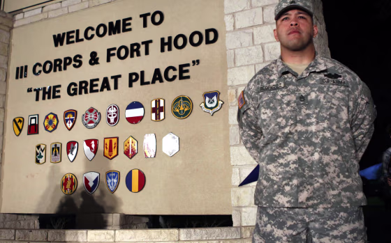 Image: Sgt. First Class Rodriguez stands guard before a news conference at Fort Hood Army Post in Texas
