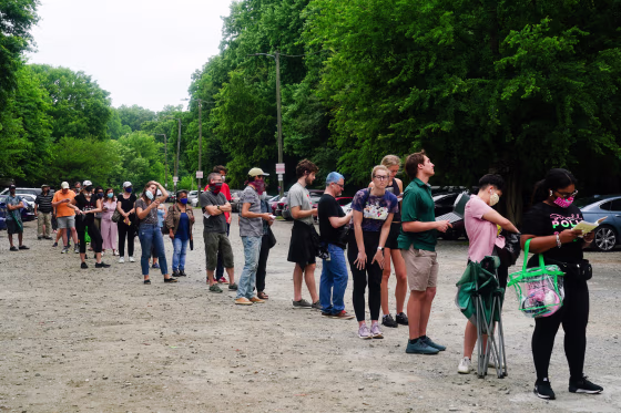 Voters wait in line on June 9, 2020 in Atlanta.