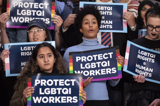 Activists rally in support of LGBTQ rights at City Hall in New York on Oct. 8, 2019.