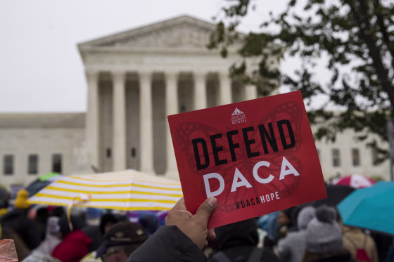 People rally outside the Supreme Court as oral arguments are heard in the case of President Trump's decision to end the Obama-era Deferred Action for Childhood Arrivals program on Nov. 12, 2019.