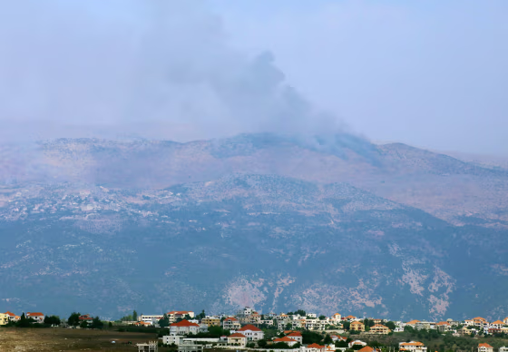Image: Smoke rises from the disputed Shebaa Farms area as seen from Marjayoun village