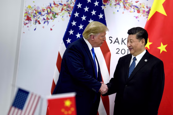 Image: President Donald Trump greets China's President Xi Jinping during the G20 Summit in Osaka on June 29, 2019.