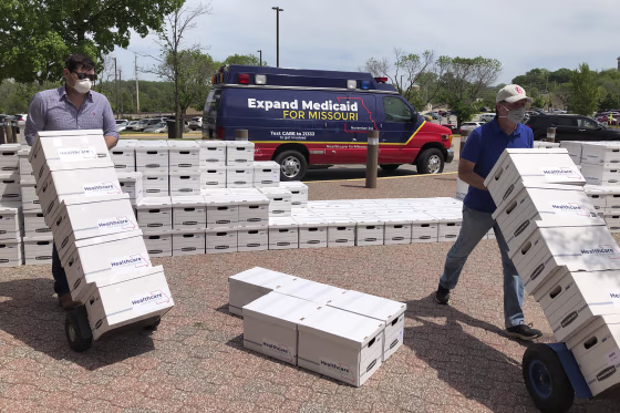 Campaign workers deliver boxes of initiative petitions signatures to the Missouri secretary of state's office in Jefferson City, Mo., on May 1, 2020. The Healthcare for Missouri campaign said it gathered nearly 350,000 signatures for a proposed constitutional amendment expanding Medicaid coverage to thousands of low-income adults.