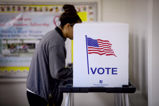 Image: A voter casts a ballot during midterm elections in Cambridge, Ohio