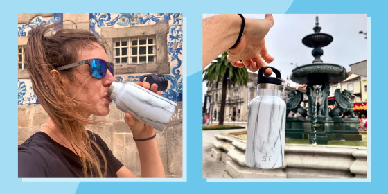 woman drinking and holding marble water bottle