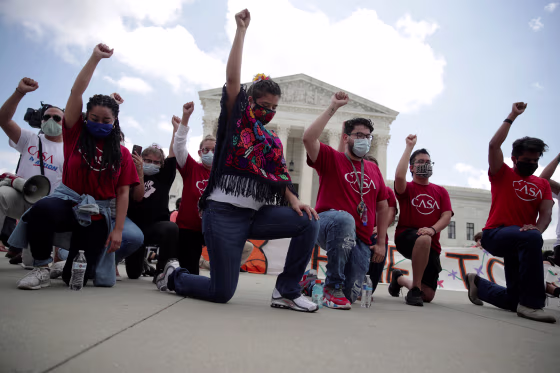 Image: People take knee in support of Black Live Matter movement outside the U.S. Supreme Court in Washington