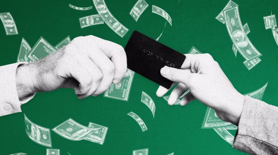 Image: Hands exchange a credit or debit card as money falls against a green background.